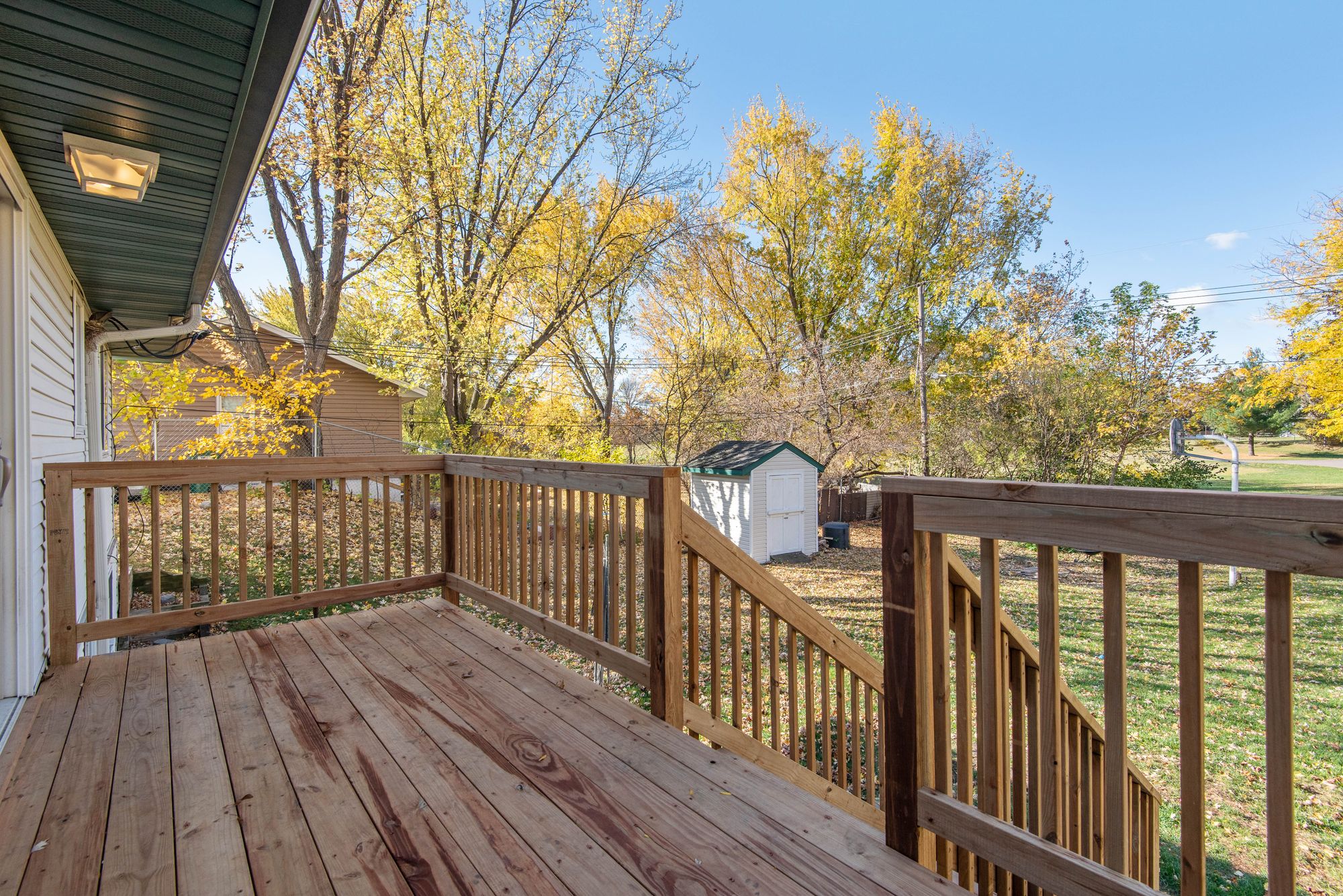 Wood deck with railing and stairs